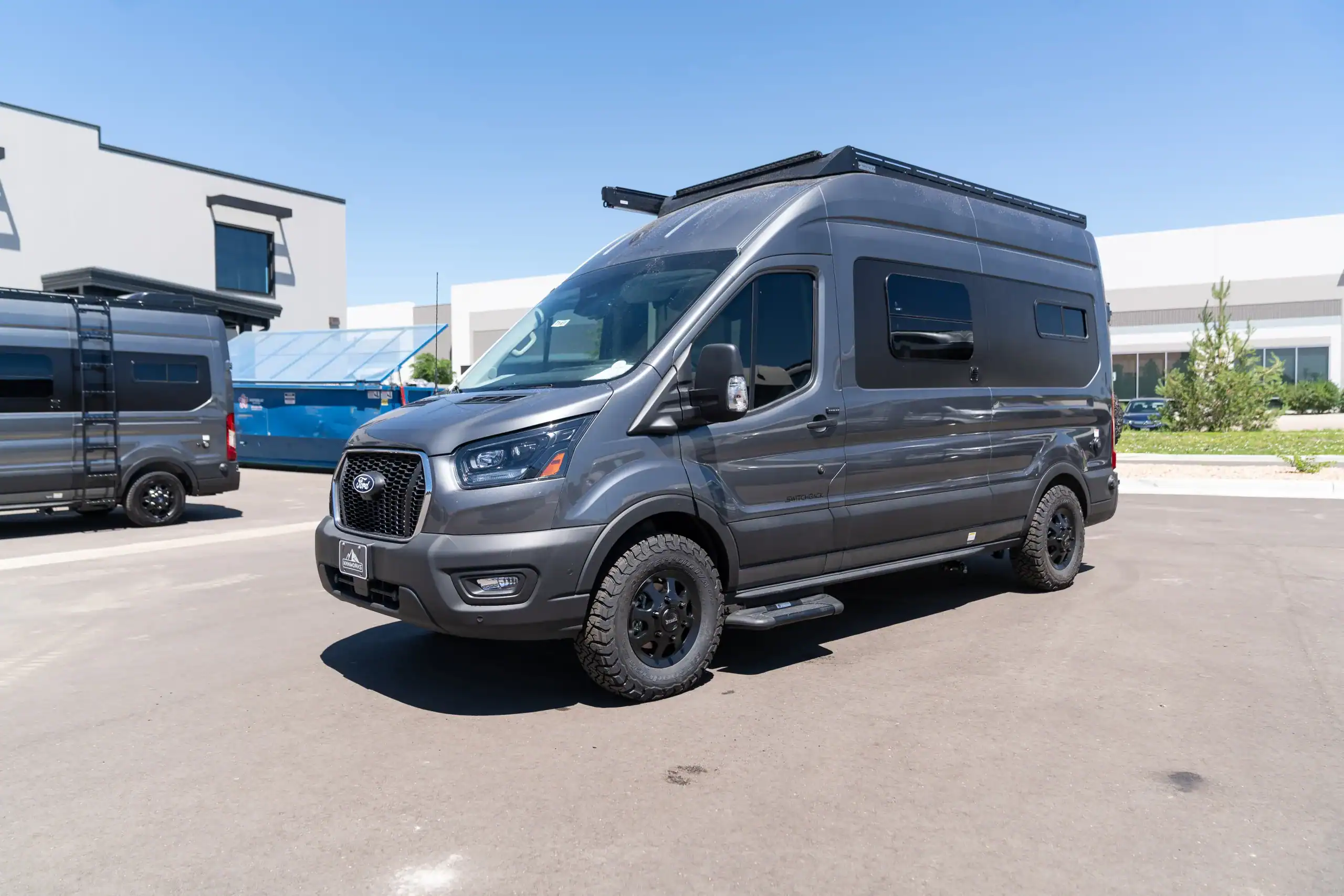 Black 2026 Switchback S4 Transit van parked outdoors.