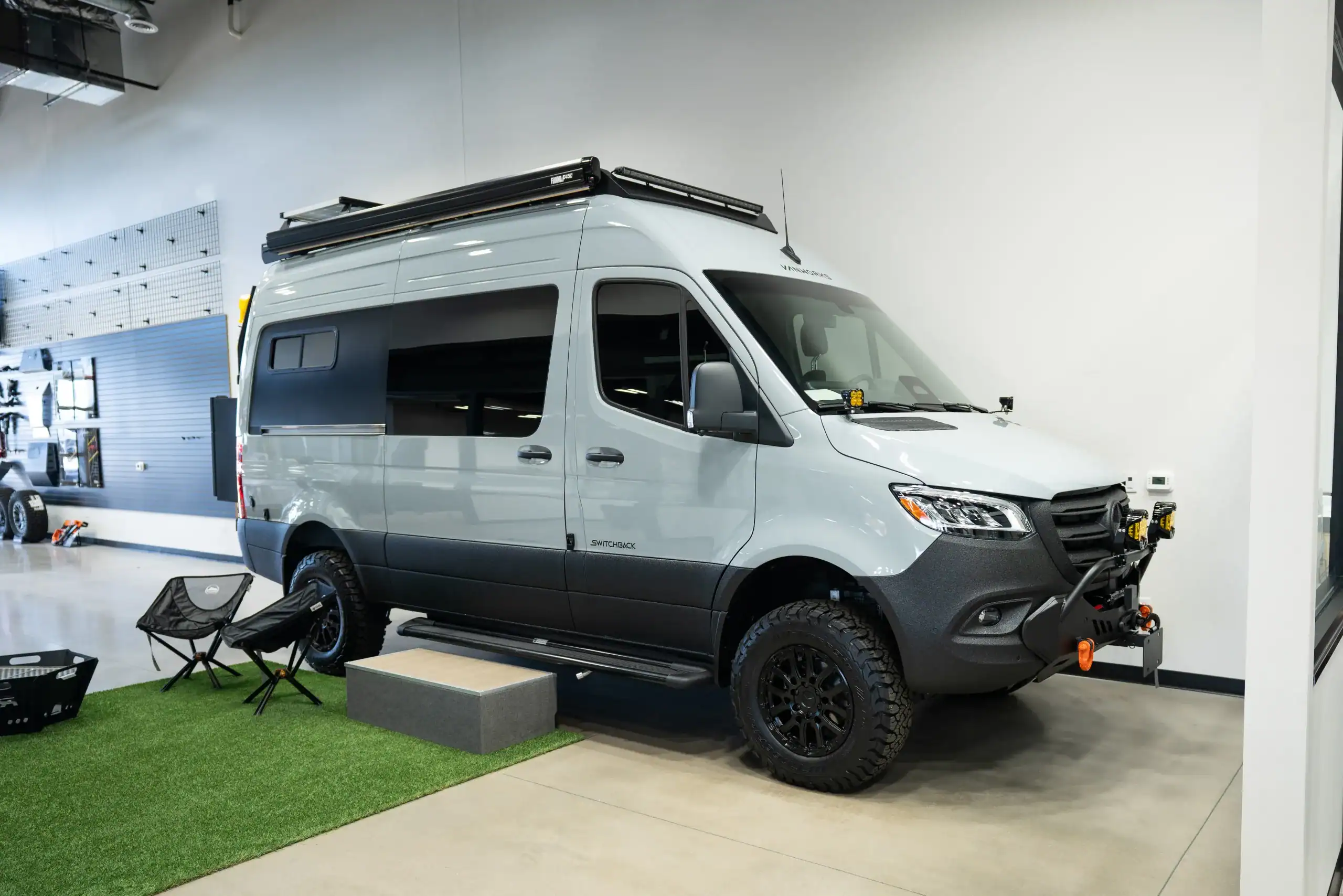Custom van conversion of a Sprinter 144 by Vanworks in a showroom.