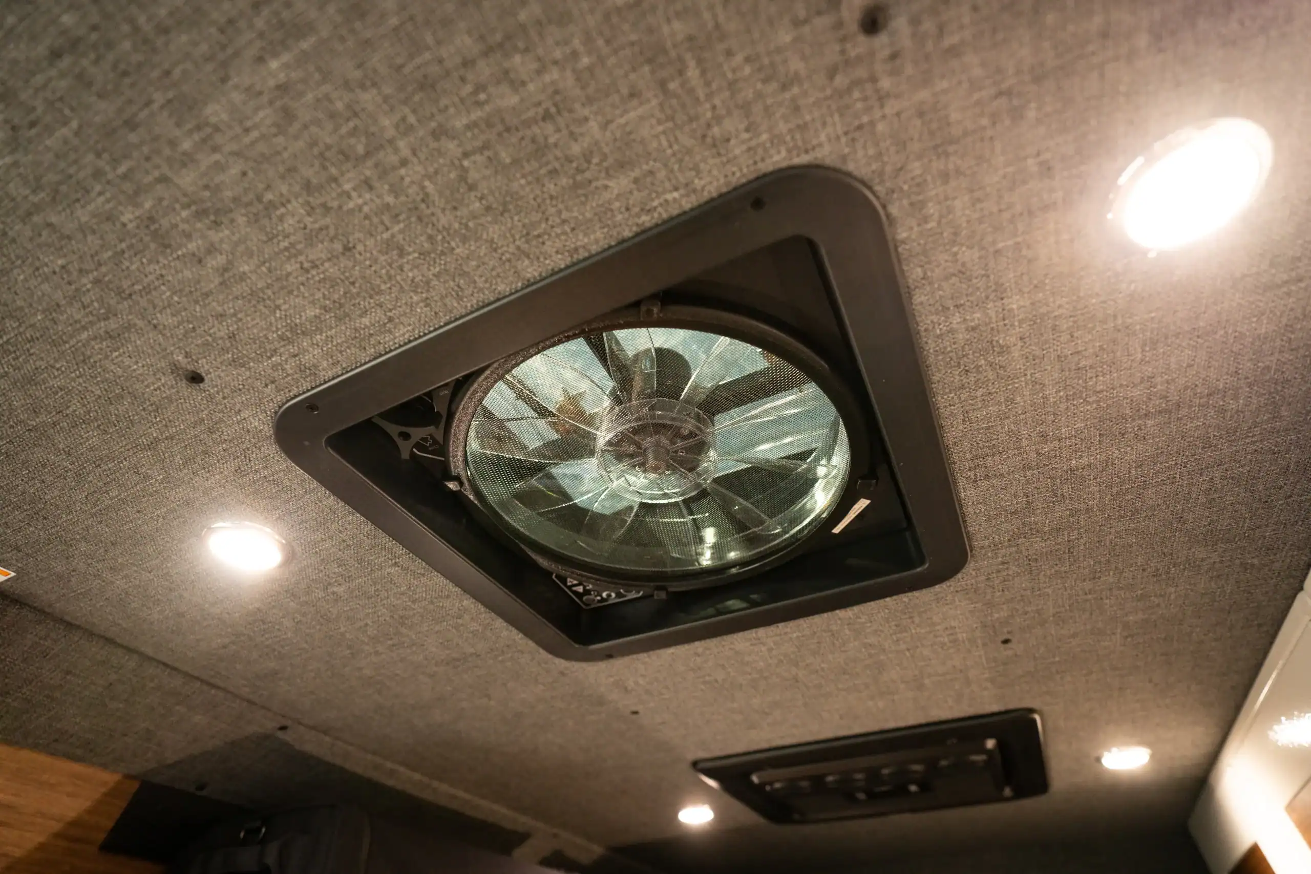 Interior ceiling with LED lights and roof vent in Vanworks Sprinter van.