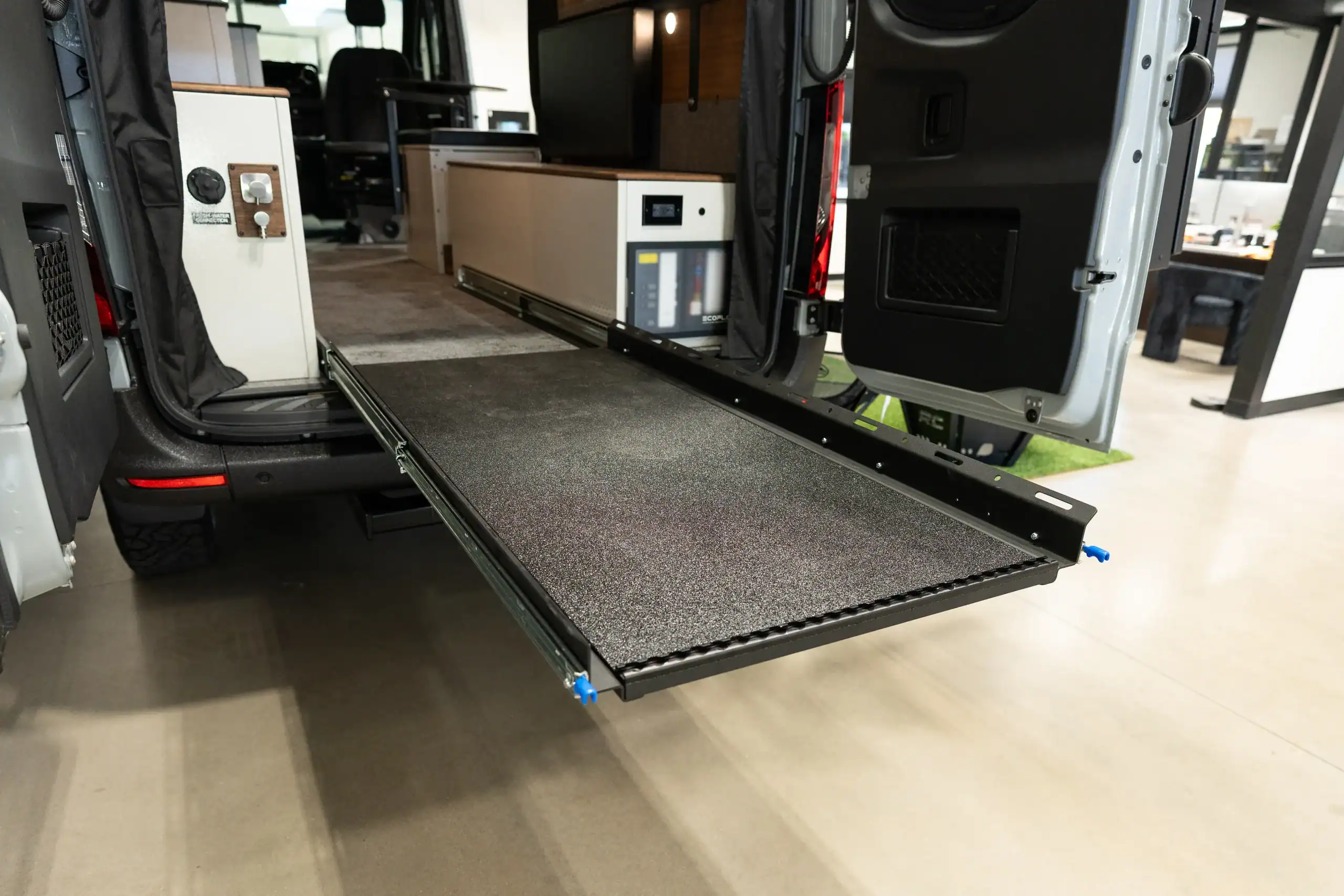 Vanworks Switchback Sprinter 144" show van with lowered rear ramp.